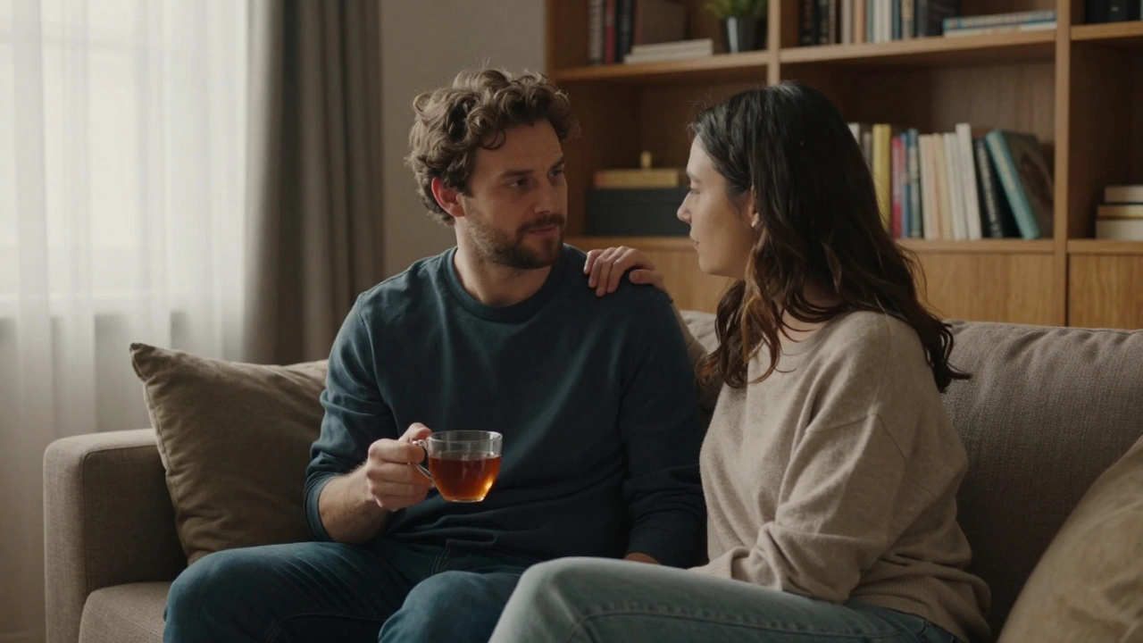 A couple sitting together on a sofa in a cozy apartment, sharing tea and quiet companionship.